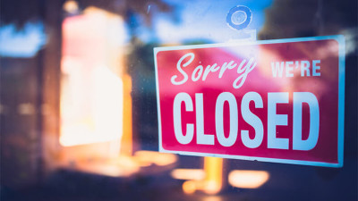 Closed Sign on Business Door