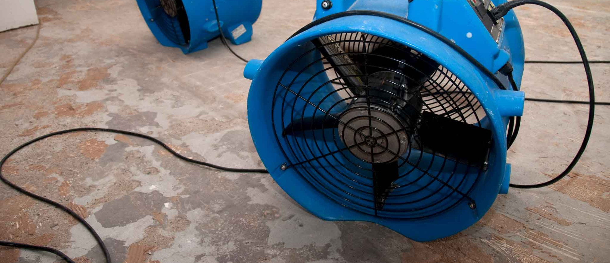 Industrial Fans Drying a Home Damaged by Water