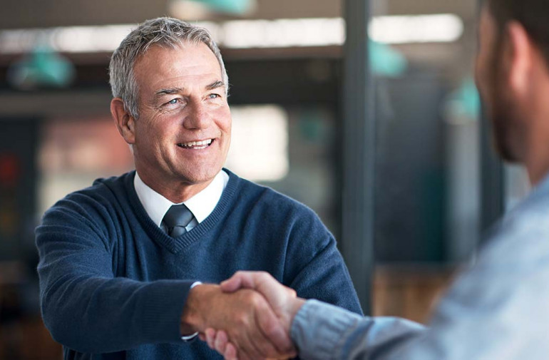 Adjuster Shaking Hands with a Client
