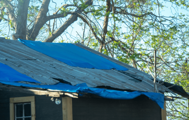 Blue Tarp on House