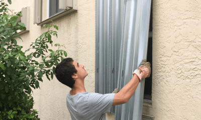 Young Man in Grey Shirt Boarding Windows to Home